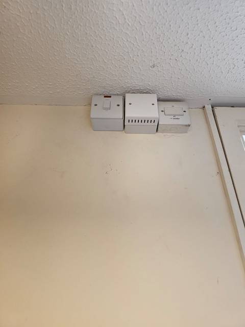 Electrical work: Surface wiring, Trunking, isolators and new sockets